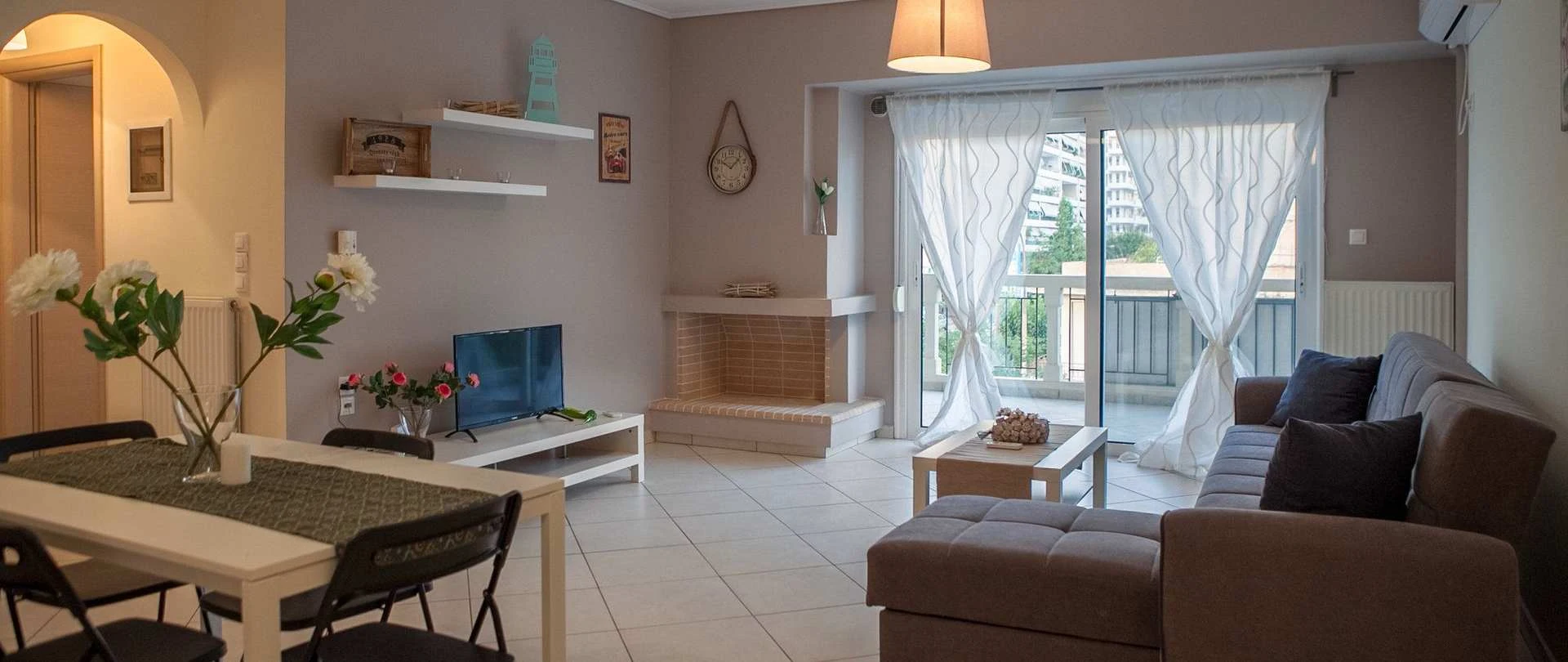Living room and balcony at LAK Nirvana in Athens
